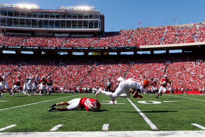 Oct 1, 2022; Madison, Wisconsin, USA; Illinois Fighting Illini wide receiver Isaiah Williams (1) is tackled by Wisconsin Badgers cornerback Justin Clark (21) during the second quarter at Camp Randall Stadium. Mandatory Credit: Jeff Hanisch-USA TODAY Sports